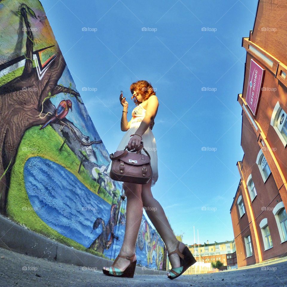 girl in the city and street art