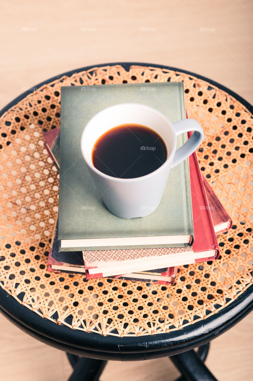 A few books with cup of coffee and cookies on wooden floor. Time for relax. Spending leisure time on reading. Cozy and comfortable. Learning from books 📖Studying for the next exam 😌