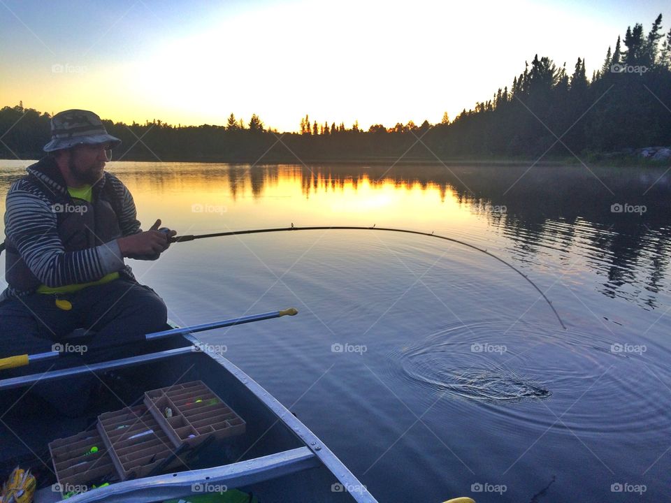 Mature man fishing in lake