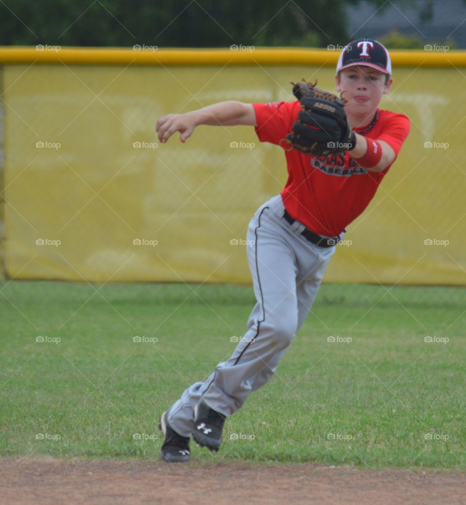 Teenage boy catching ball