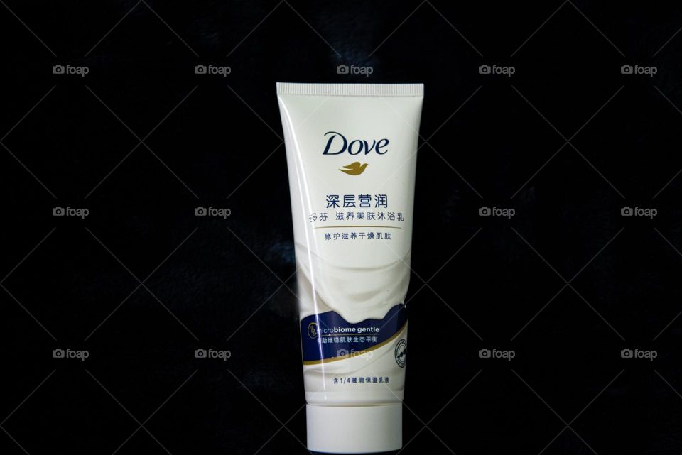 A close up of Dove face wash.