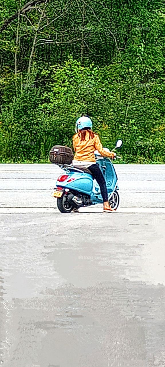 Woman on Blue Bike Traveling