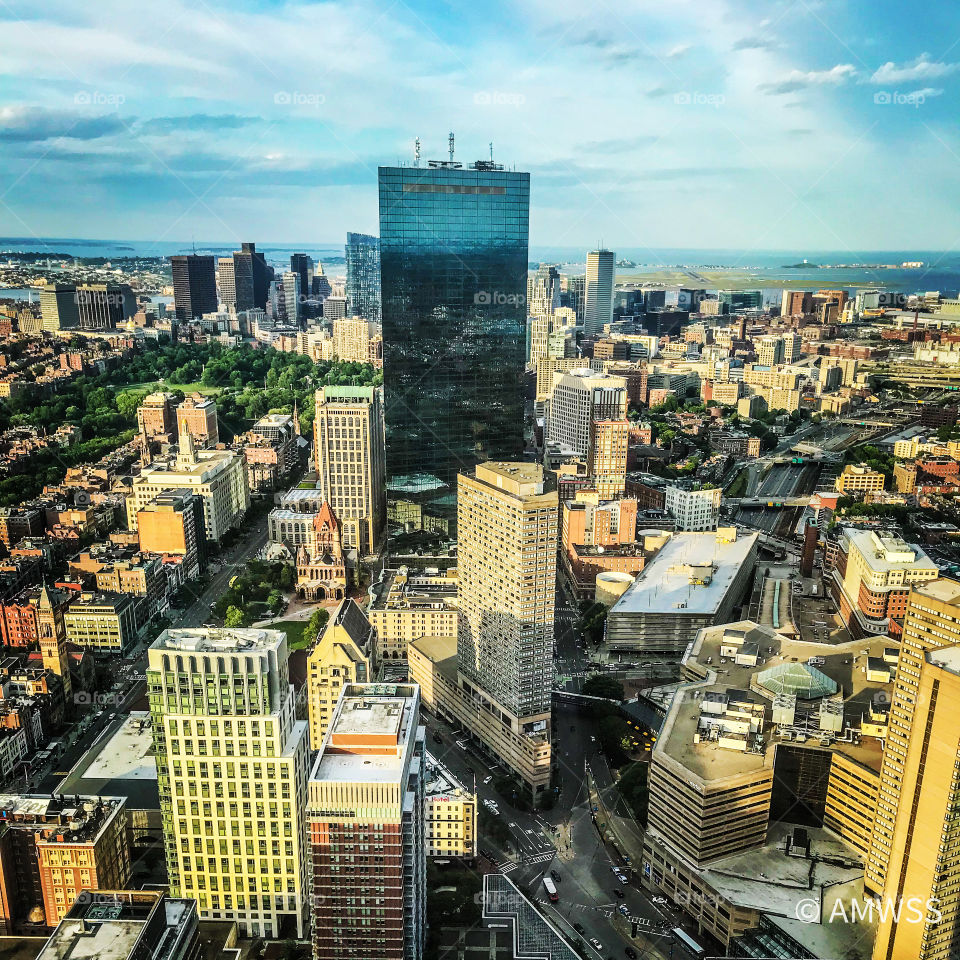 The city of Boston Massachusetts viewed from the Prudential Center. Blue skies 