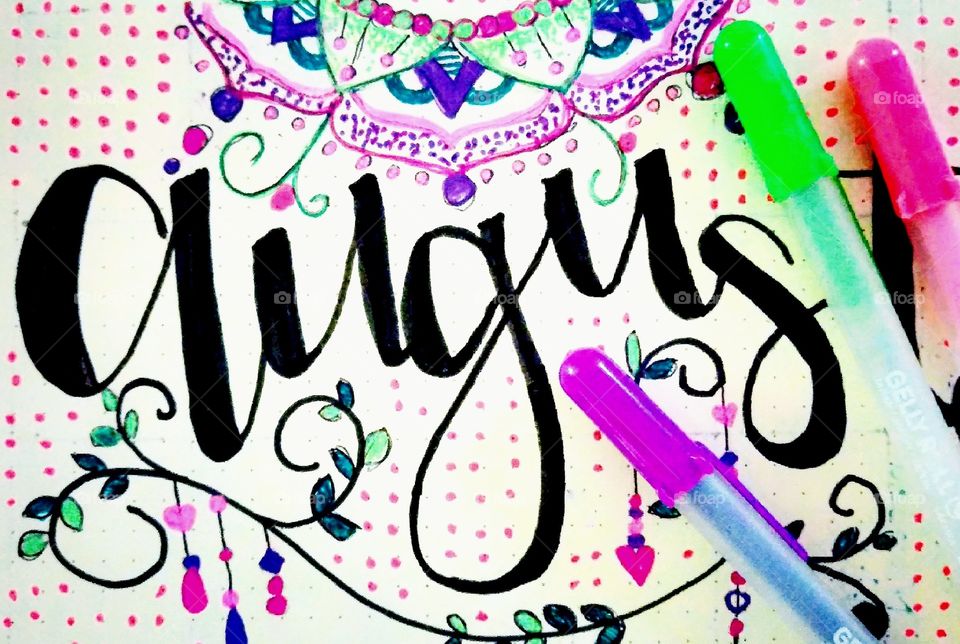 Hand drawn lettering August bujo layout using Gelly Rollers