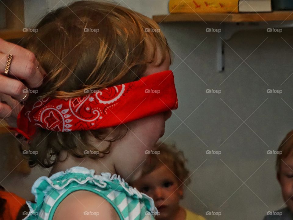 Child Blindfolded For Party Game
