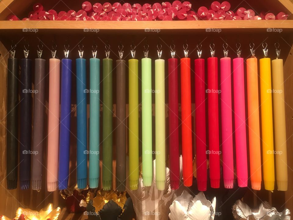 Multicoloured selection of wax candles for sale at Fortnum and Mason department store on Piccadilly, London