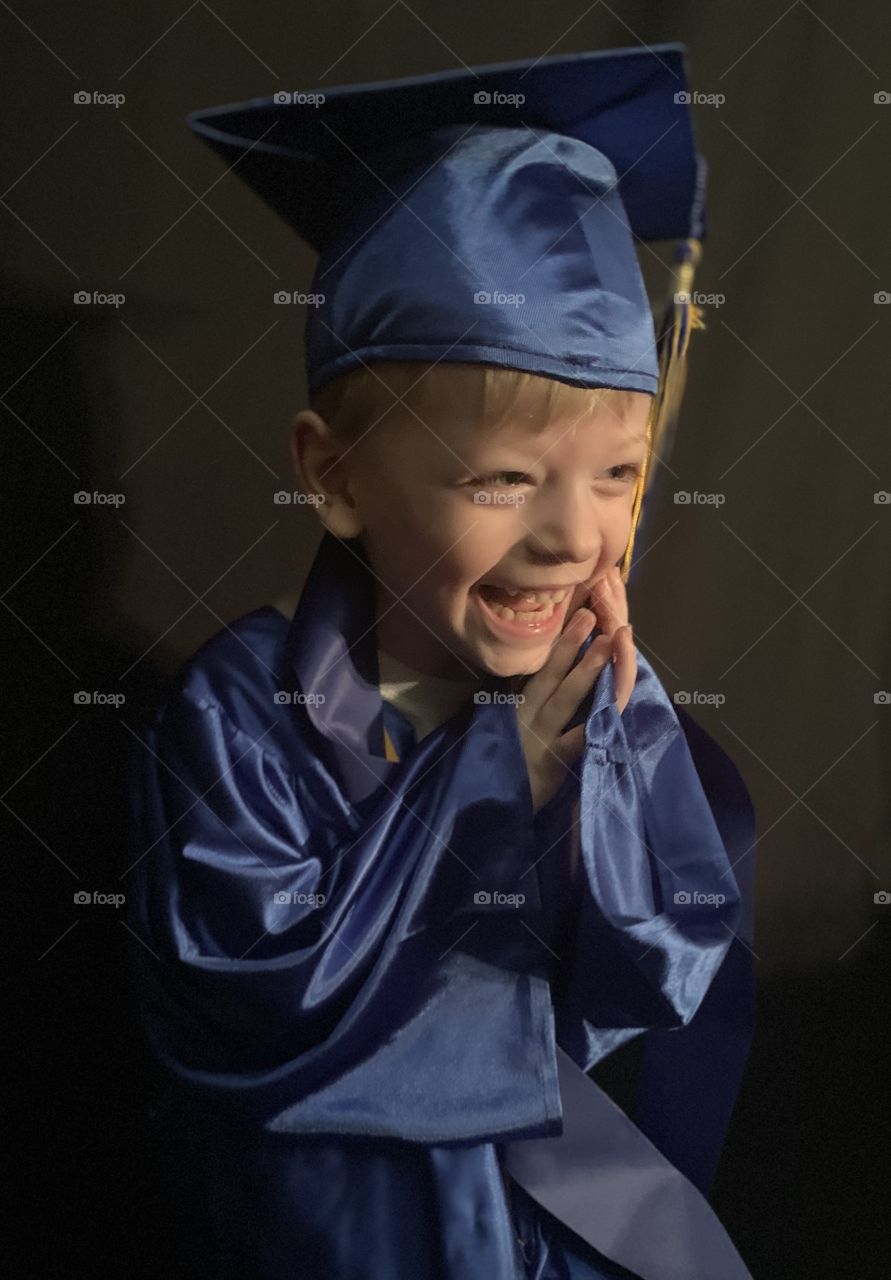 Excited boy graduated from preschool
