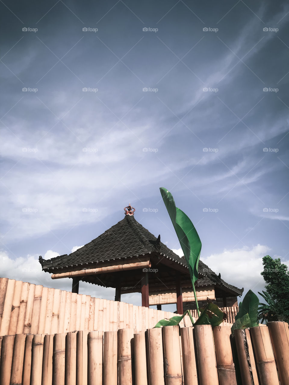 Wooden hut, sitting down and relax, enjoying the beautiful and bright day around, Bali, Indonesia