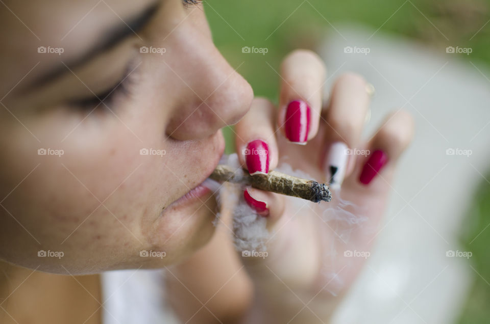 Woman smoking a cannabis joint