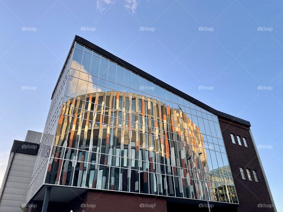 Reflection of the Main Point Karlin office building in the glass facade of the building next door in Prague, Czech Republic.