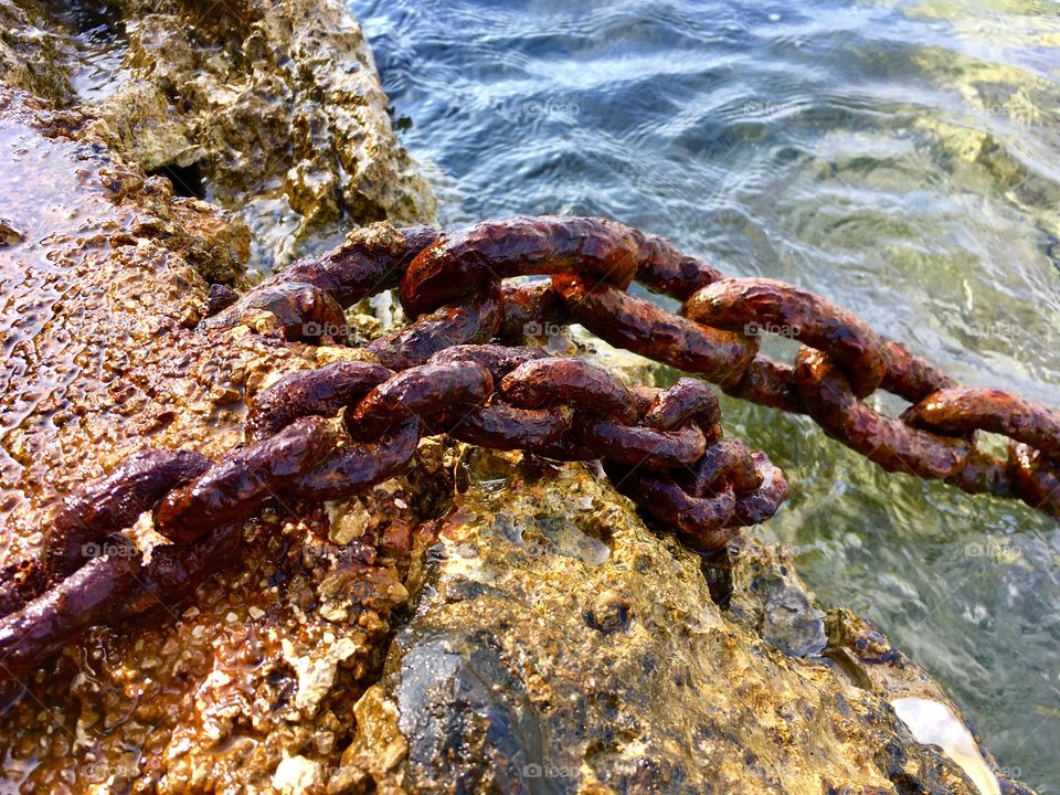 detail of old rusty chains of mooring
