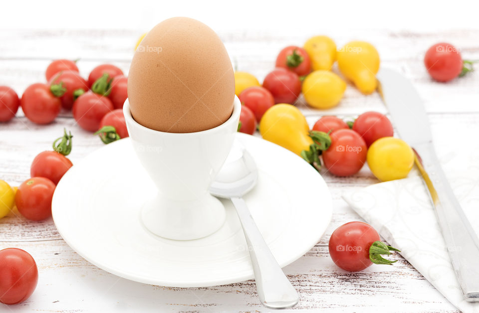 Boiled egg with cherry tomatoes