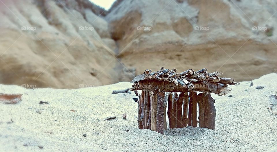 stick house with cliffside view