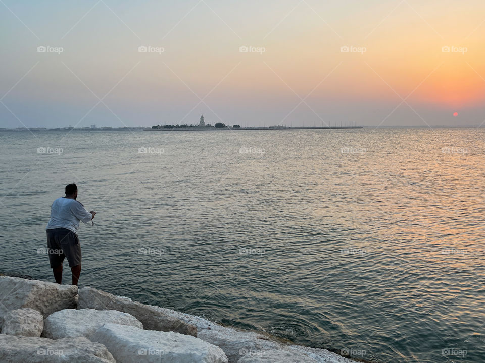 Beautiful sun set and fisherman 