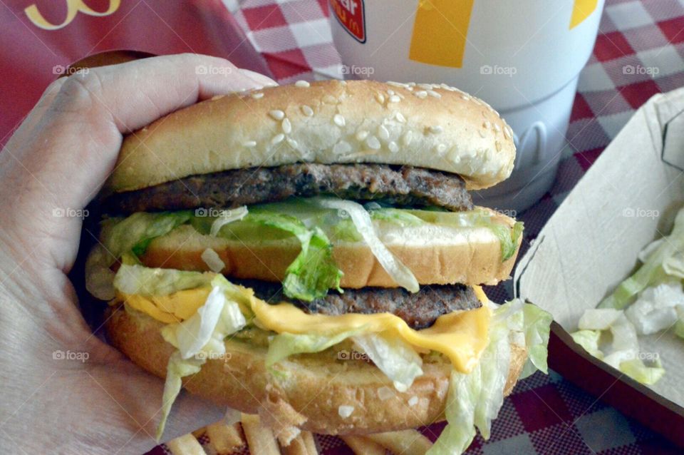 McDonald’s Big Mac, fries and drink on a red a white checkered background 