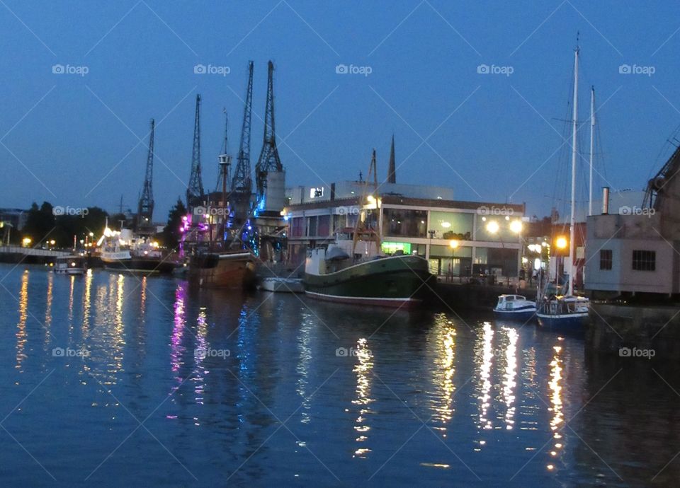 Bristol floating harbour on a evening with lights reflecting on the water