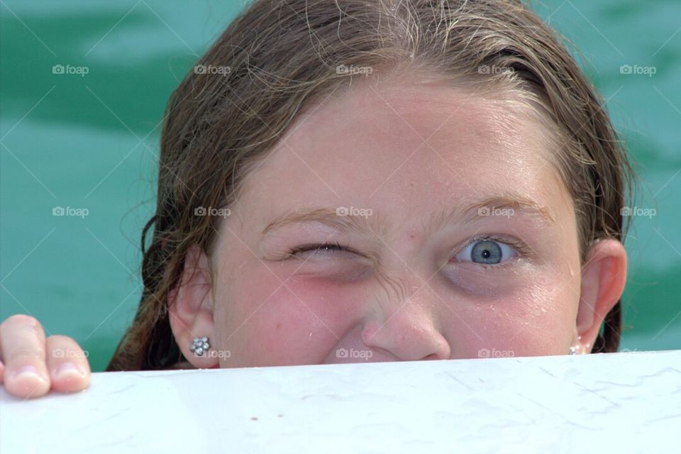 Close-up of a girl winking