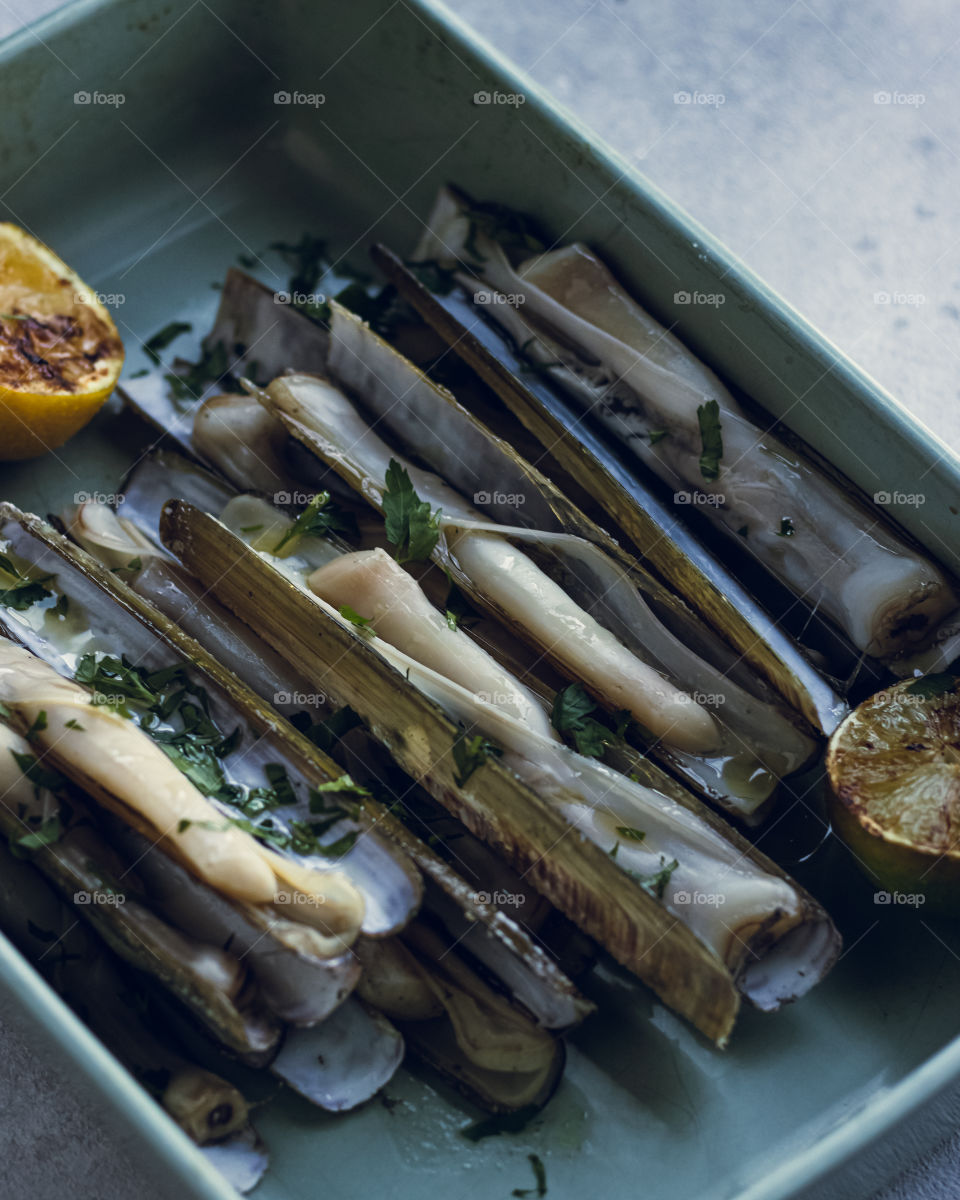 Razor clams are its finest. Delicious and lemony! Cooked over open fire 