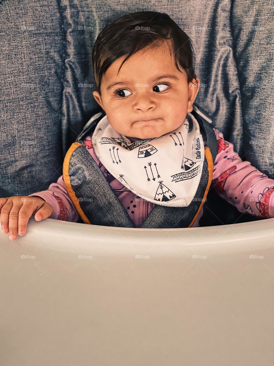 Look if disgust in baby’s face, baby gets impatient while waiting for food, looking to the side with disgust, baby shows the emotion of disgust, facial expressions of a baby girl, baby girl shows emotion of disgust 