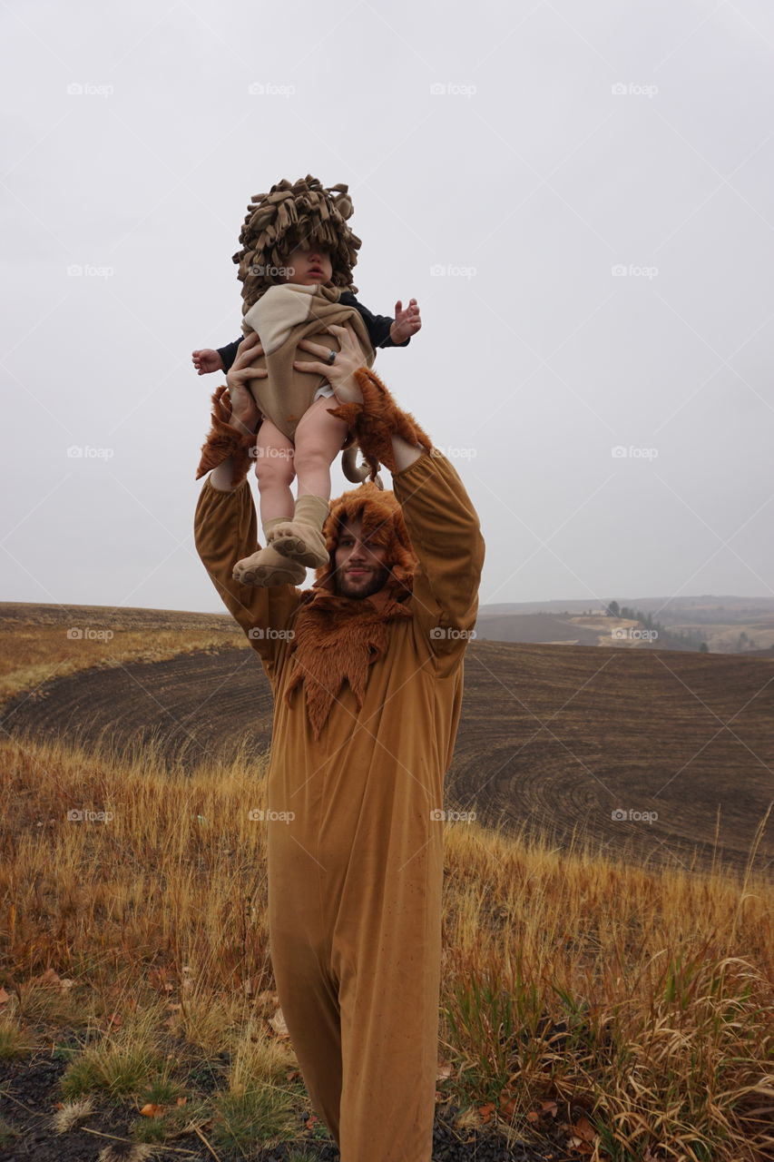 Portrait of baby and father in animal costume