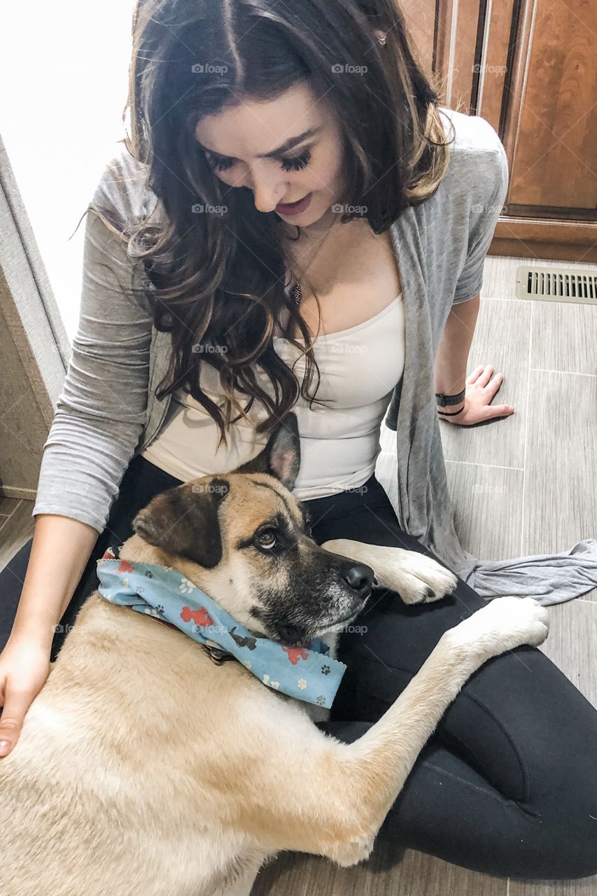 Rescue mutt lovingly cuddling with his forever mother. 