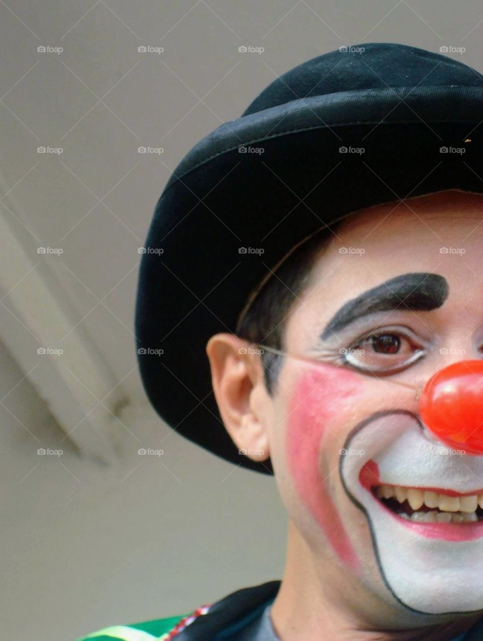 person dressed as a clown expressing joy. happy