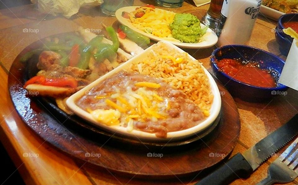 Hot smoky sizzler served on table