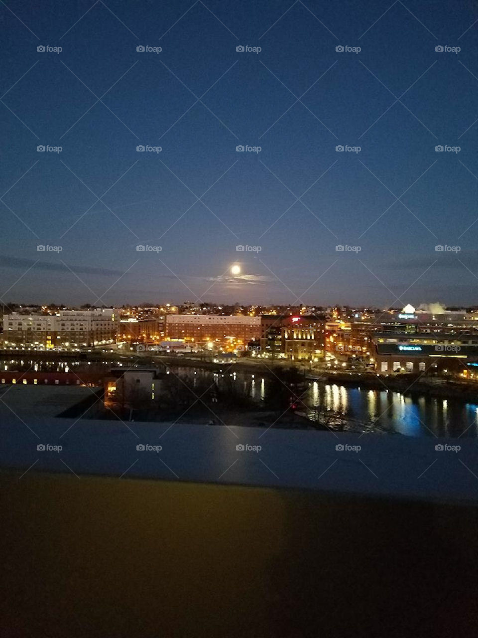 Full moon over city