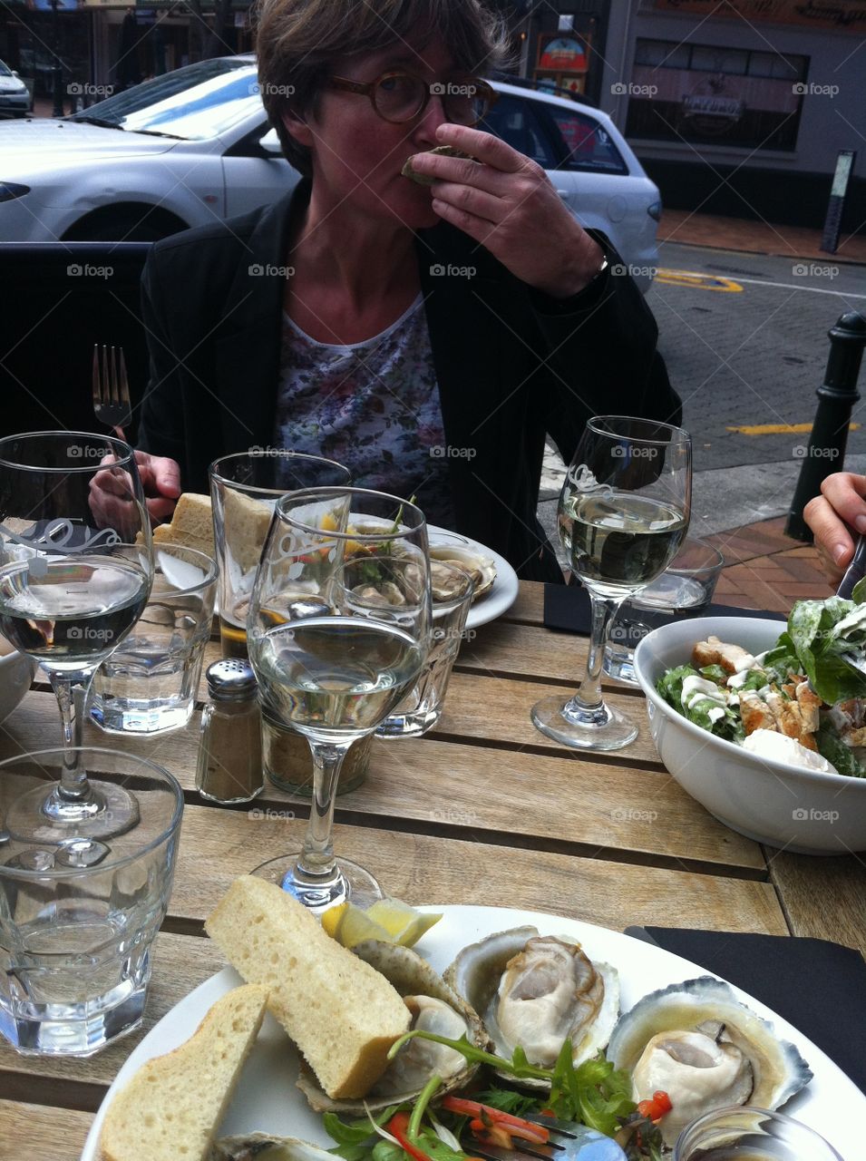 Oysters and salad. Luxury mesl with friends