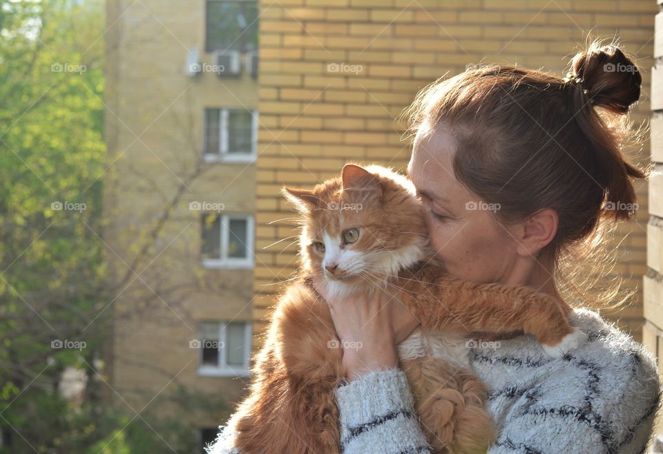 woman and ginger cat family relaxing, love pet