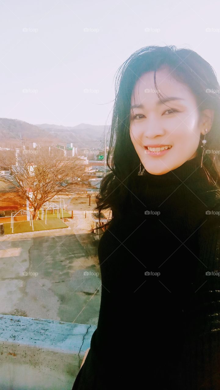 The over looking view from the roof top of our home where u can see the big tree that standing alone and the houses beside it.
you can see also the mountains which is so much far from here.