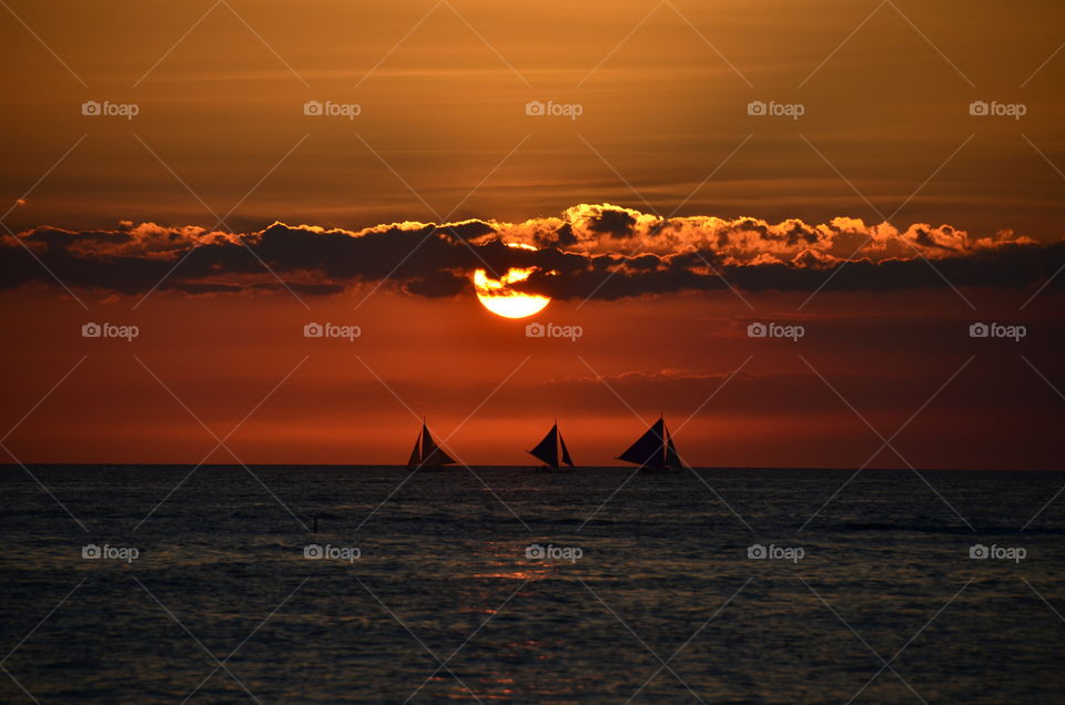 The view of the sunset over the Boracay island in the Philippines