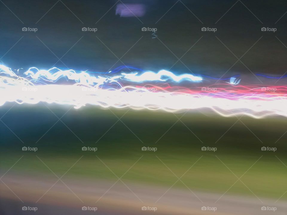 City night lights perspective blurred by high speed of the car. Abstract City night lights. Background and texture.