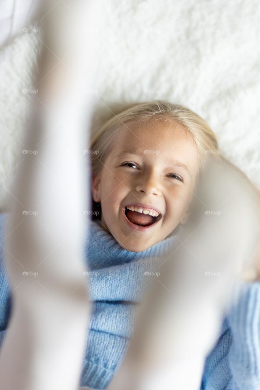 Portrait of little Caucasian girl feeling happiness 