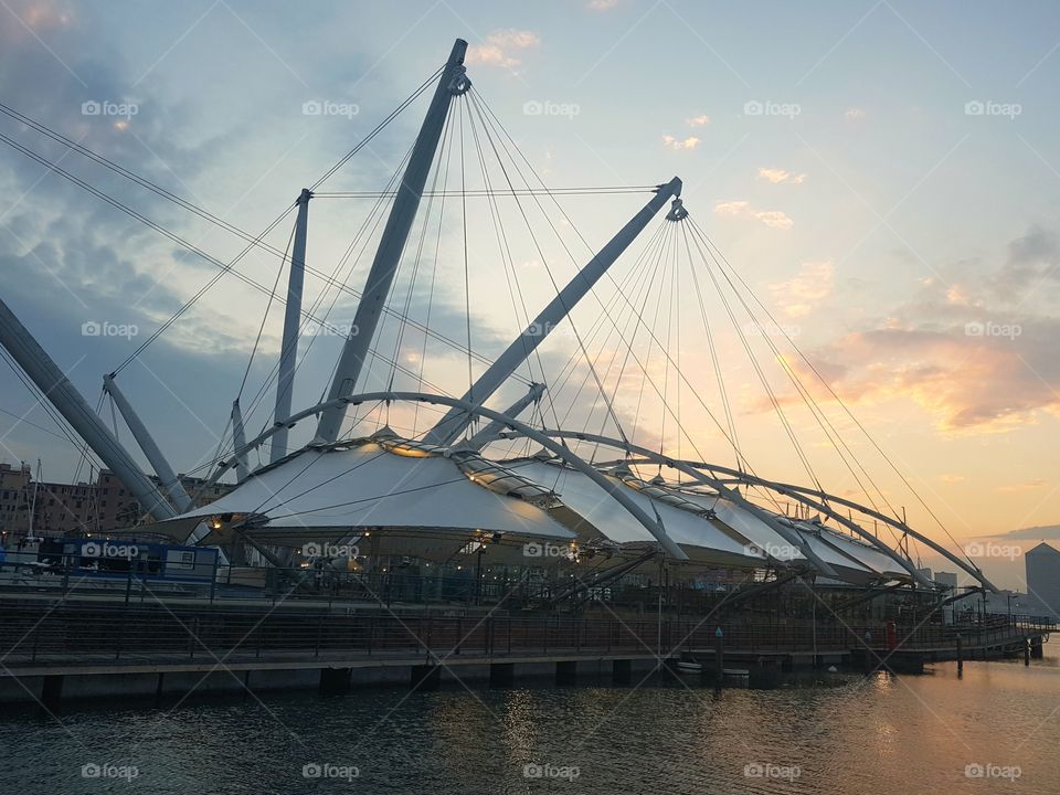 Renzo Piano architecture in the port of Genoa city at sunset
