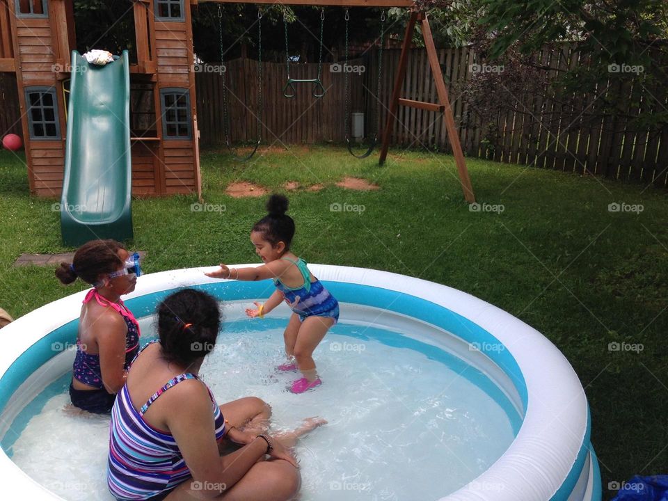 Giving Orders on Fun. C telling cousins what they need to do to make the pool time more fun