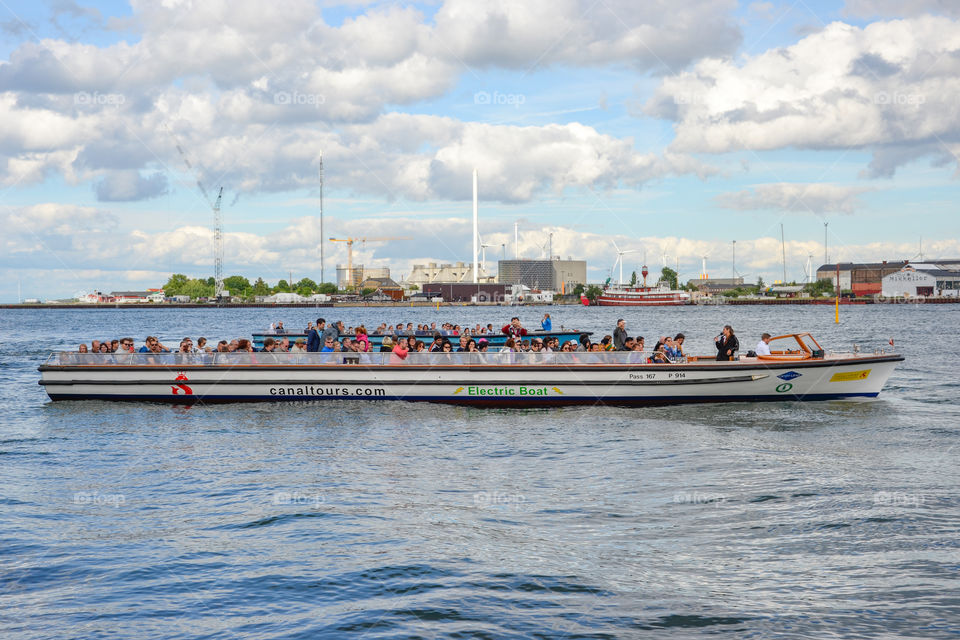 Sightseeing boat with tourists in Copenhagen Denmark.