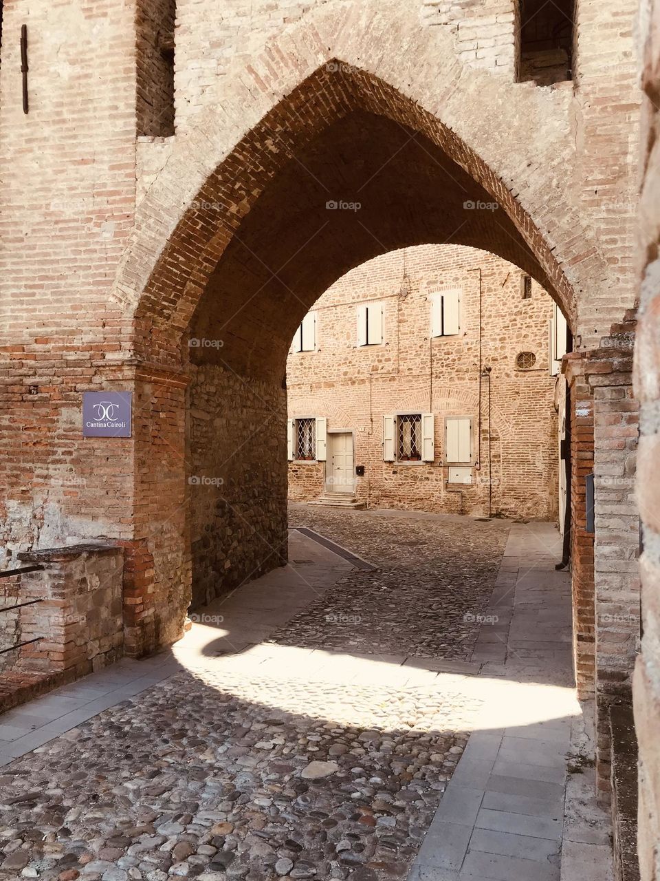 arched stone gate in the old Roman city