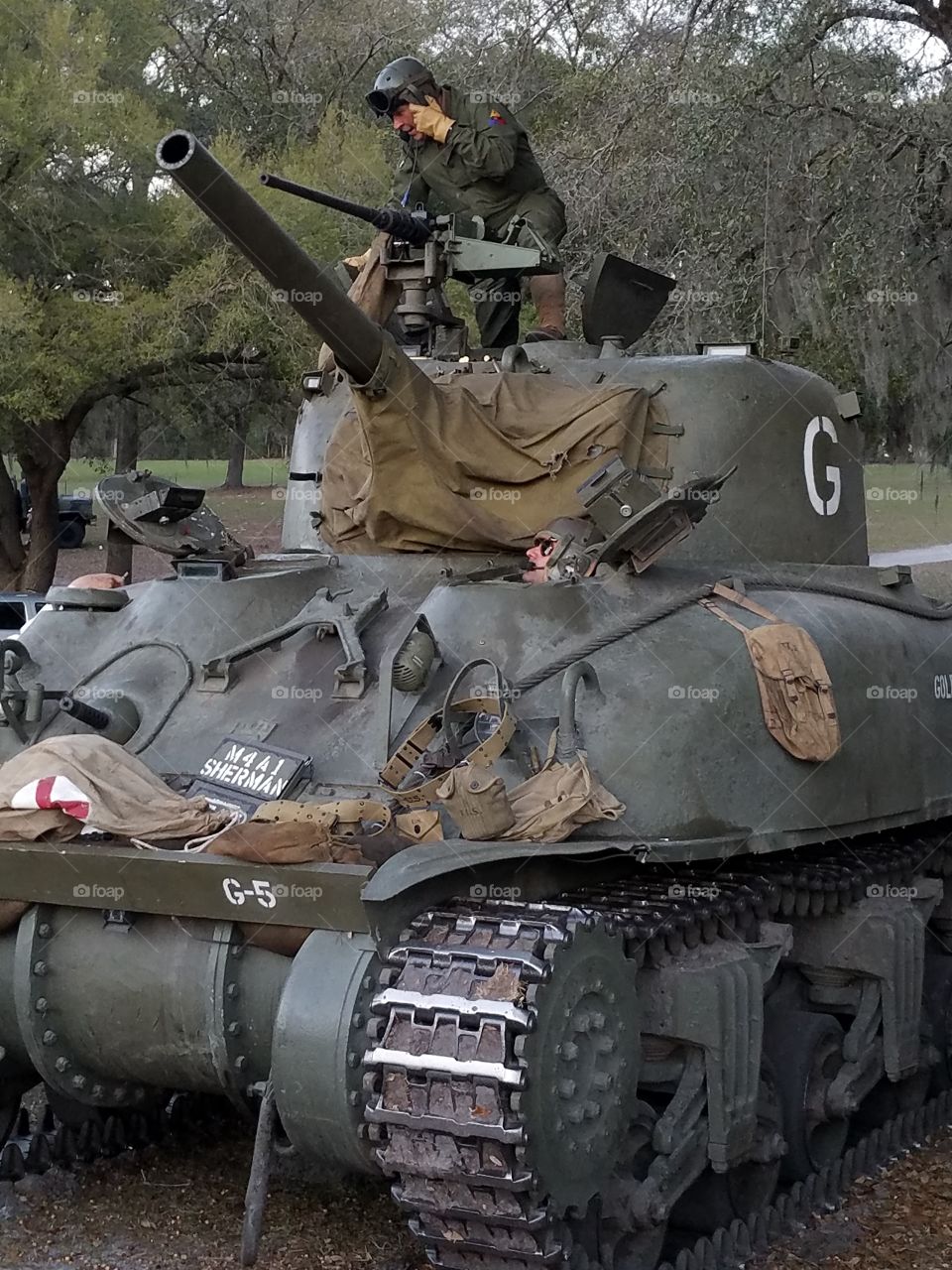 WWII reanactors in Sherman M4A1 military tank