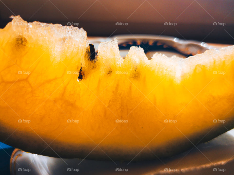 Translucent slice of yellow watermelon