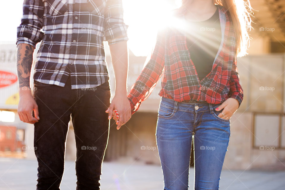 Lovely pair are holding hands