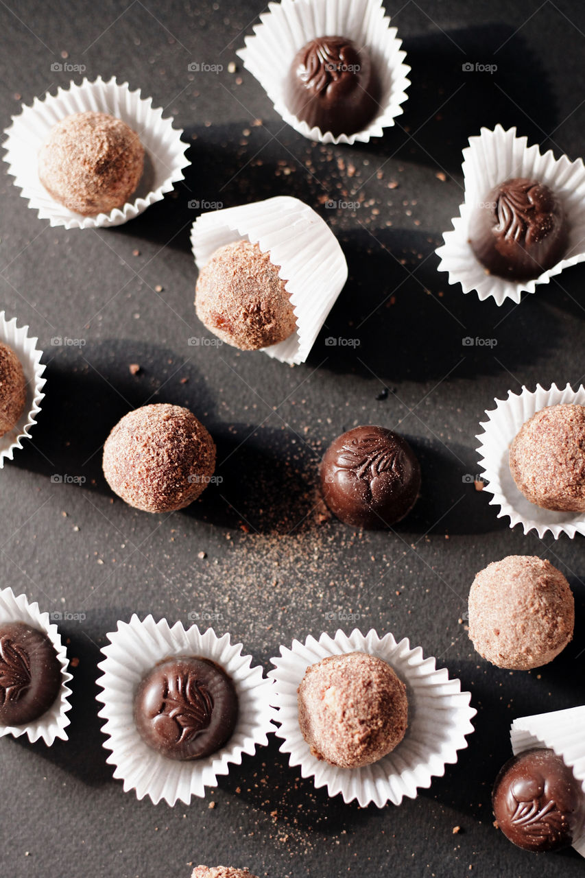 background image of chocolates on a black background