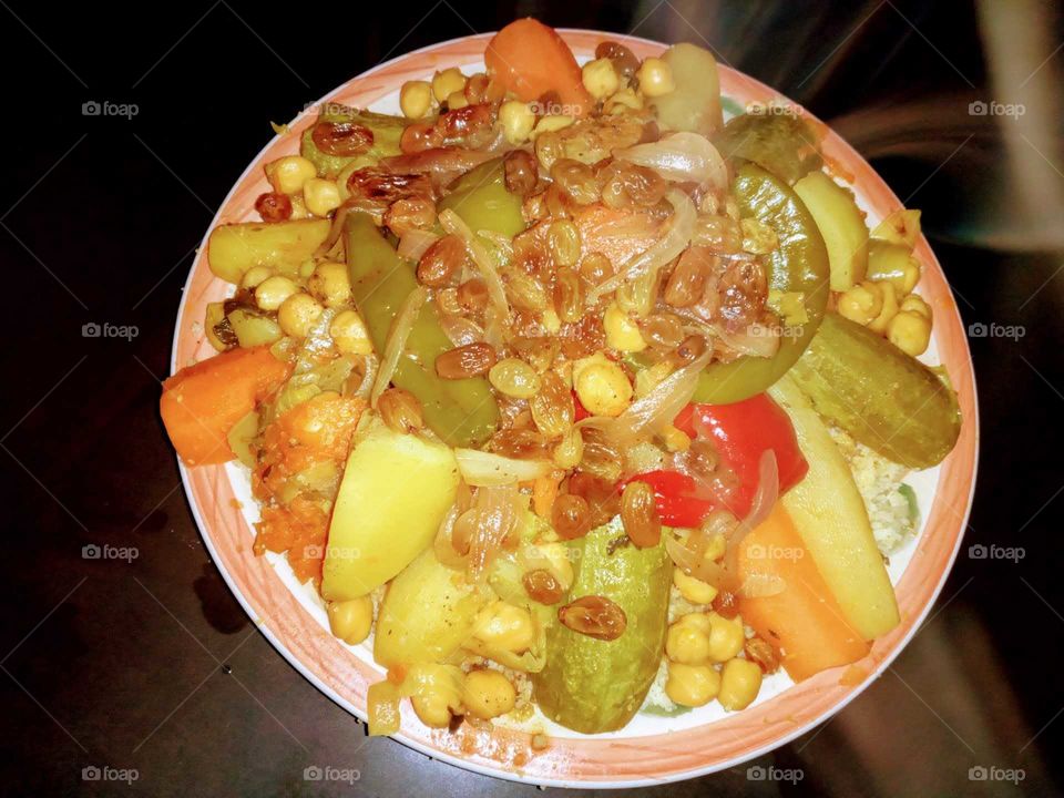 moroccan couscous dish prepared whit vegetables