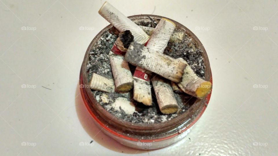 Cigarette butts in plastic containers