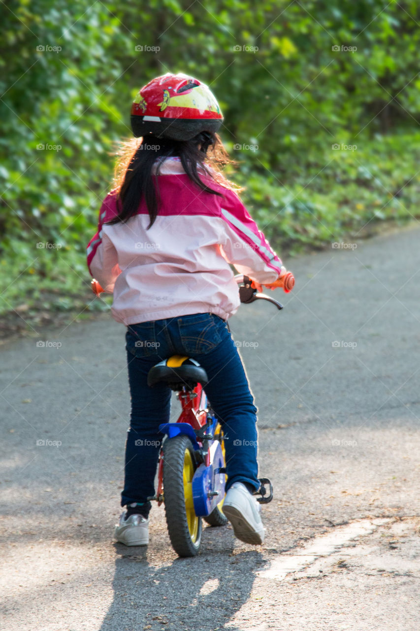 Little girl on her balance bike