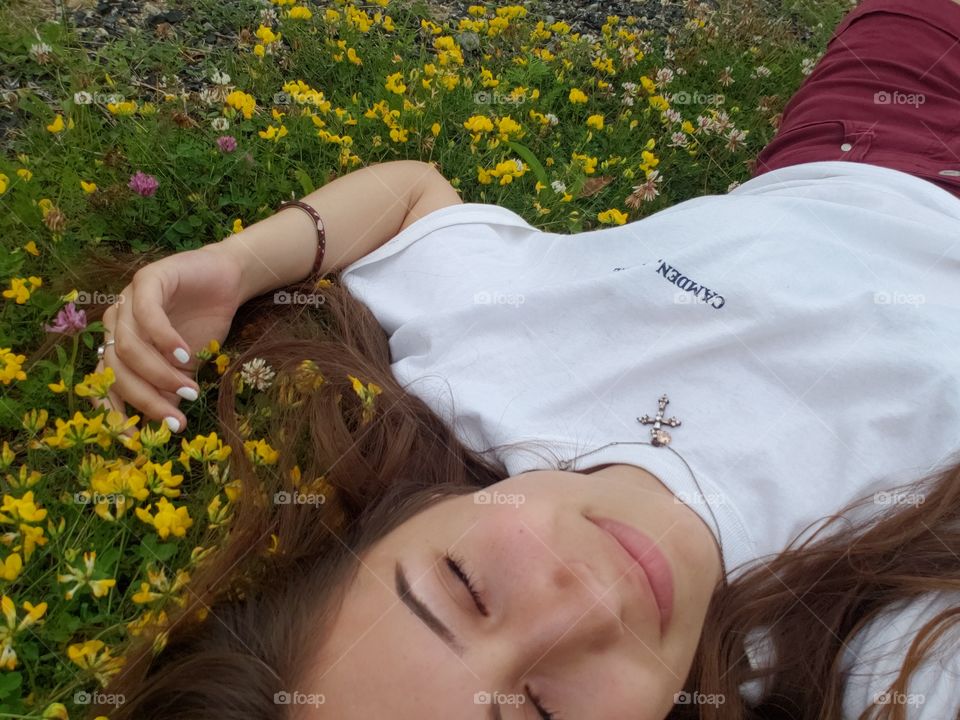 laying in flowers