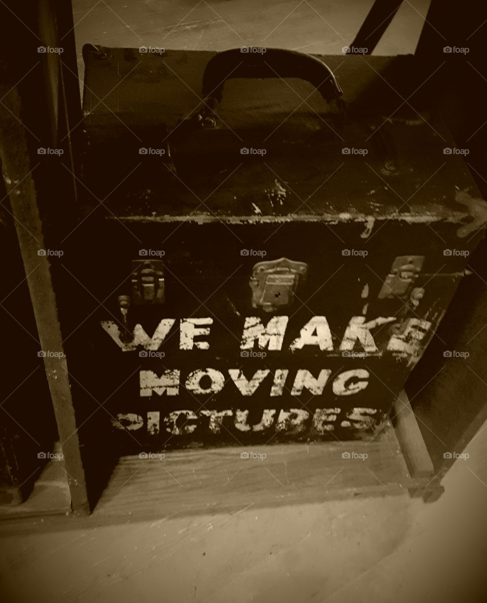 vintage box or container in sepia. photo taken at the Niles Film Museum. Box possibly used to hold movie reels.