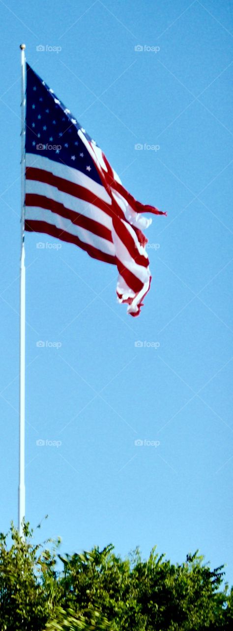 American Flag Against a Blue Sky