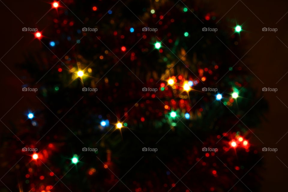 Macro shot of Christmas tree decorations and vivid lights