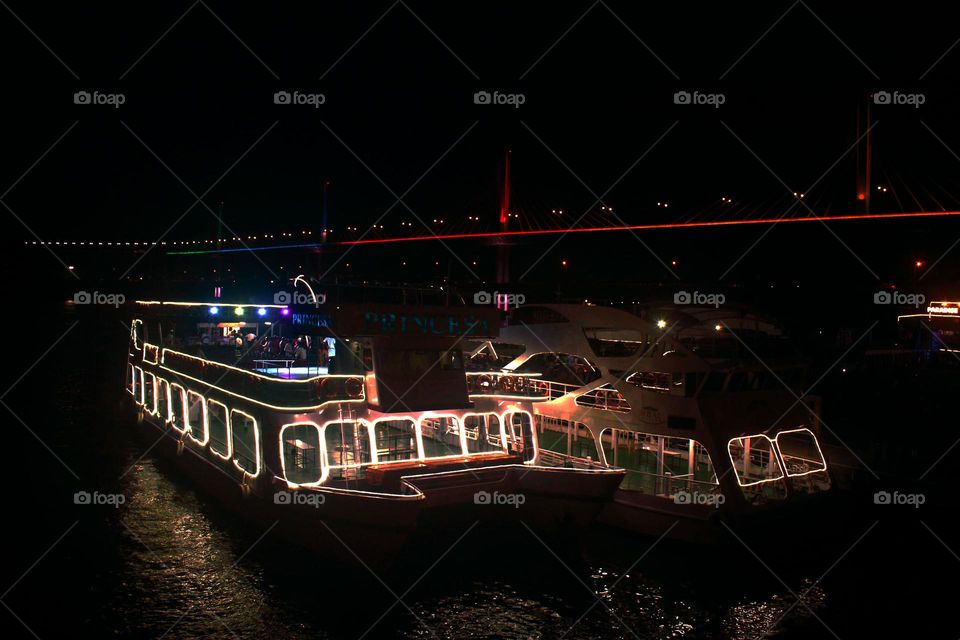 Cruising.
Cruise ships taking a pit stop while people aboard continue to party. Such a mesmerizing view to see from the shore, especially due to the contrast of night and the LED lights on the ship.